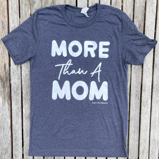 Heather navy sparkle ink tee that has the writing saying, "MORE THAN A MOM" on the front of the tee shirt