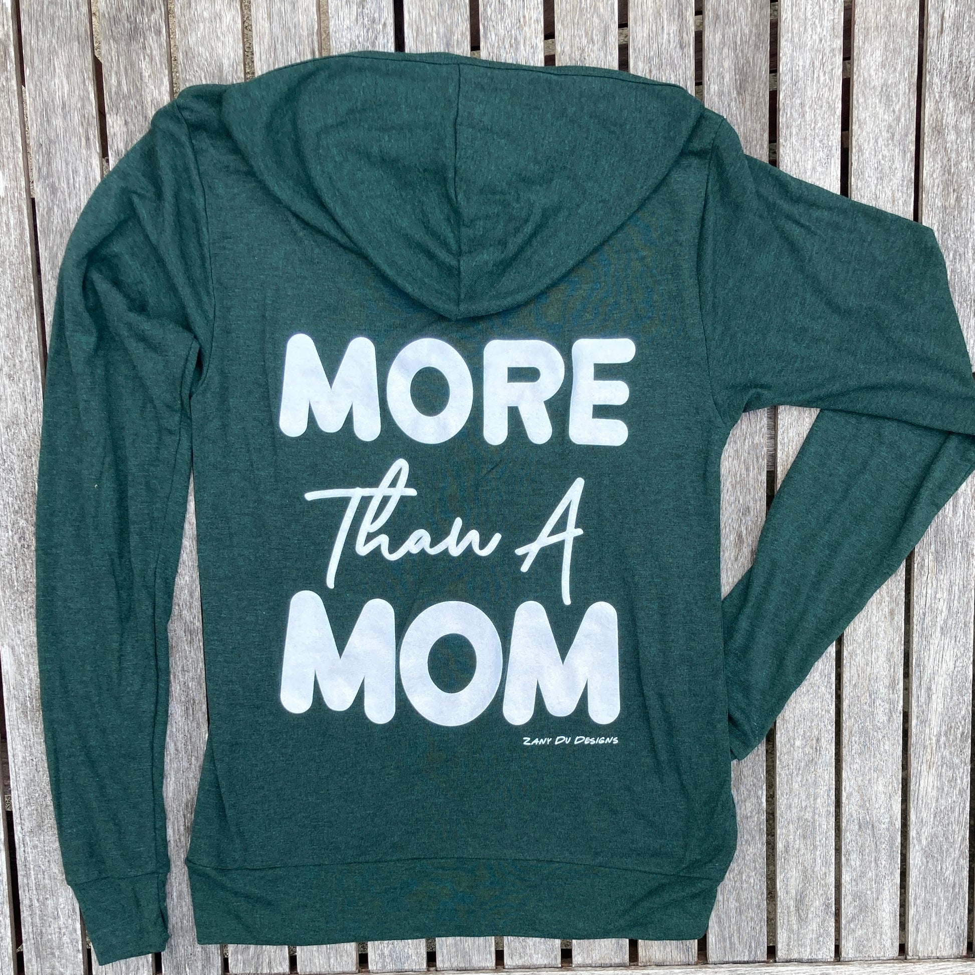 Emerald sparkle lightweight zip up hoodie with the writing saying, "MORE THAN A MOM" on the back of the hoodie.
