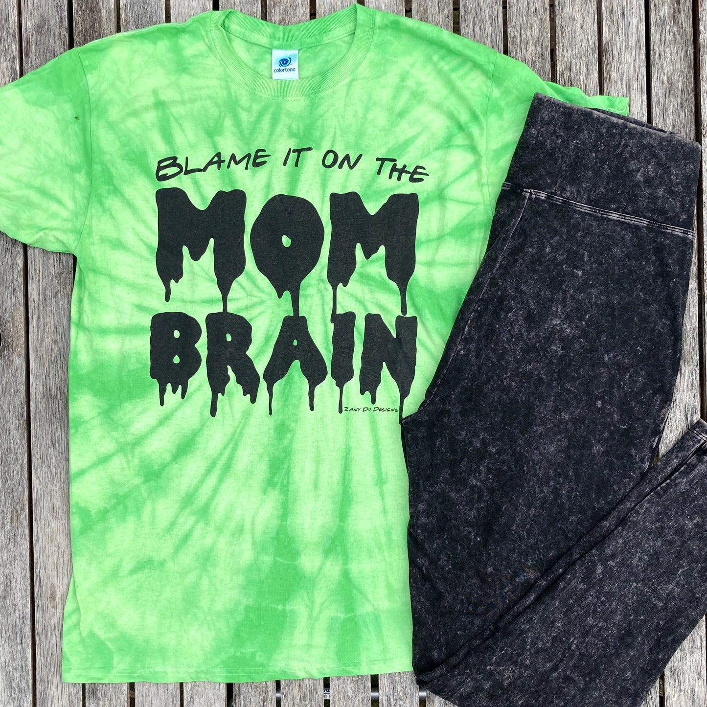 Slime green tie dye tee shirt with the writing saying, "BLAME IT ON THE MOM BRAIN", and the MOM BRAIN part has a slime font - Slime - Halloween - Spooky.