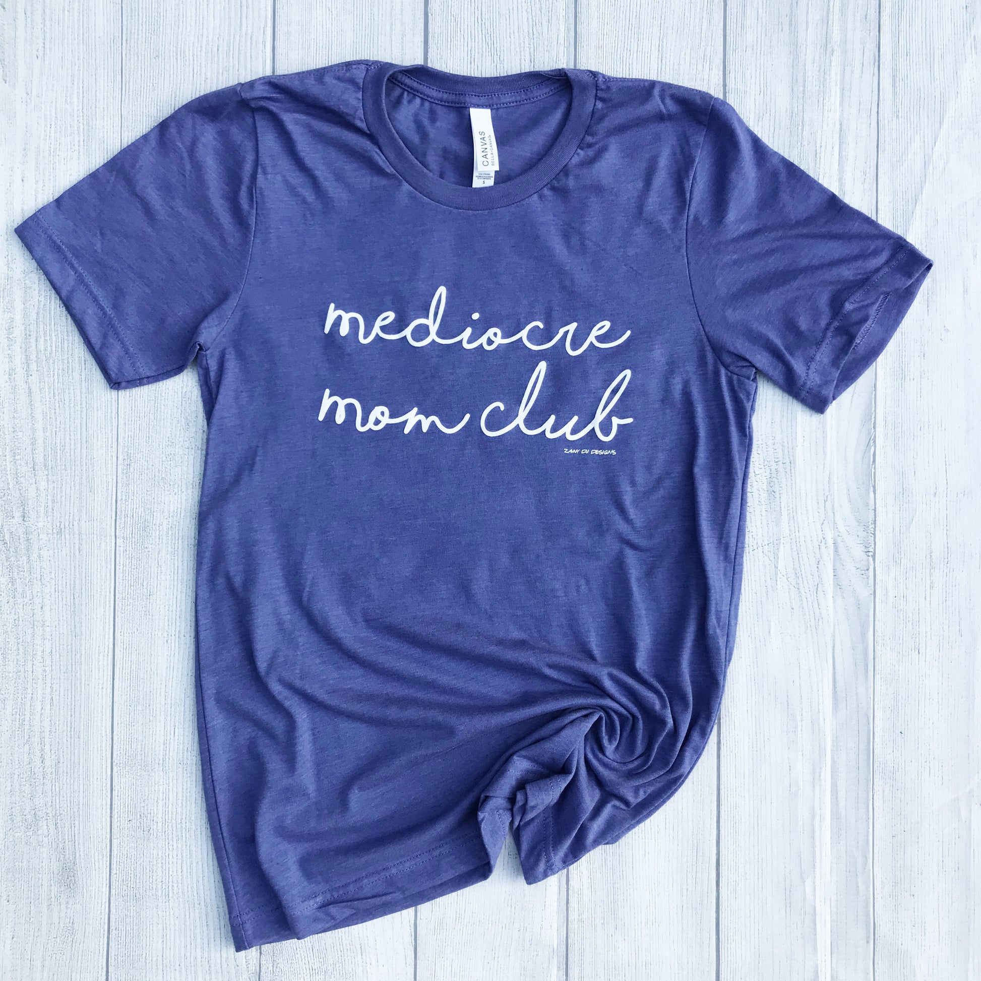 Purple short sleeve tee that says, "mediocre mom club" in cursive white writing - okay mom - hot mess mom - mom club - tee - graphic tee