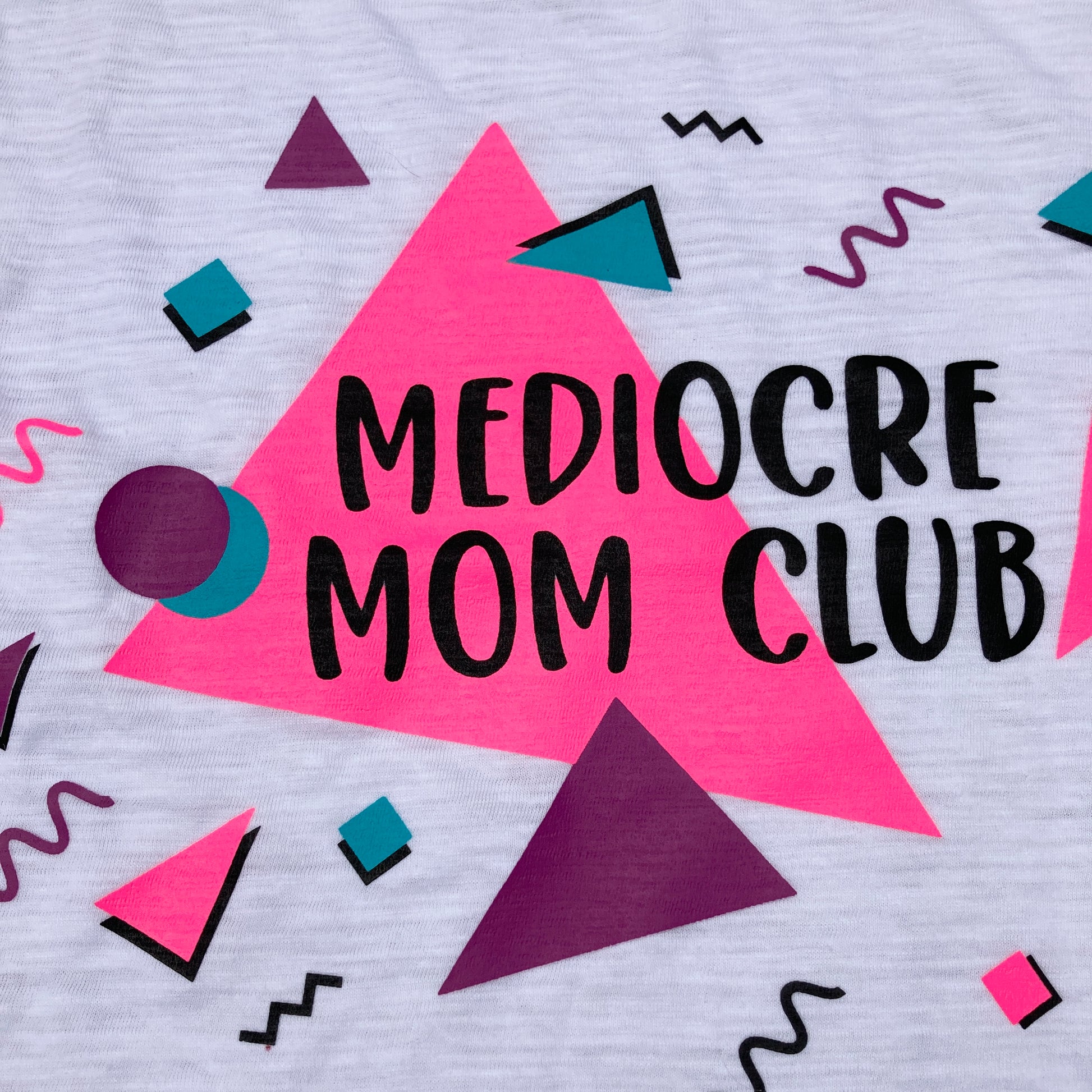 Shirt Design saying, "MEDIOCRE MOM CLUB"  - 90's - Retro -  Pink, Purple, and Blue font colors.