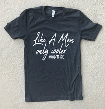 Black short sleeve tee that says, "Like A Mom only cooler #AUNTLIFE" and everything but #AUNTLIFE is in a cursive font. - aunt - auntlife - cool aunt - short sleeve - graphic tee - tshirt