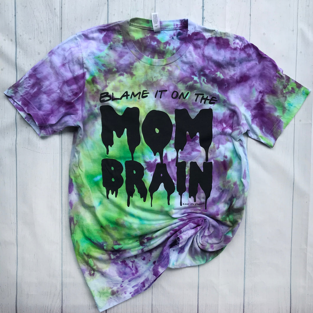Green and purple tie dye with the writing saying, 