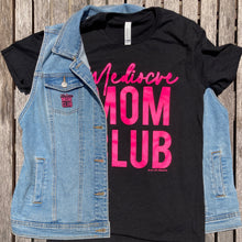 Mom club neon pink on black stacked tee with the writing in neon pink saying, "Mediocre MOM CLUB" 