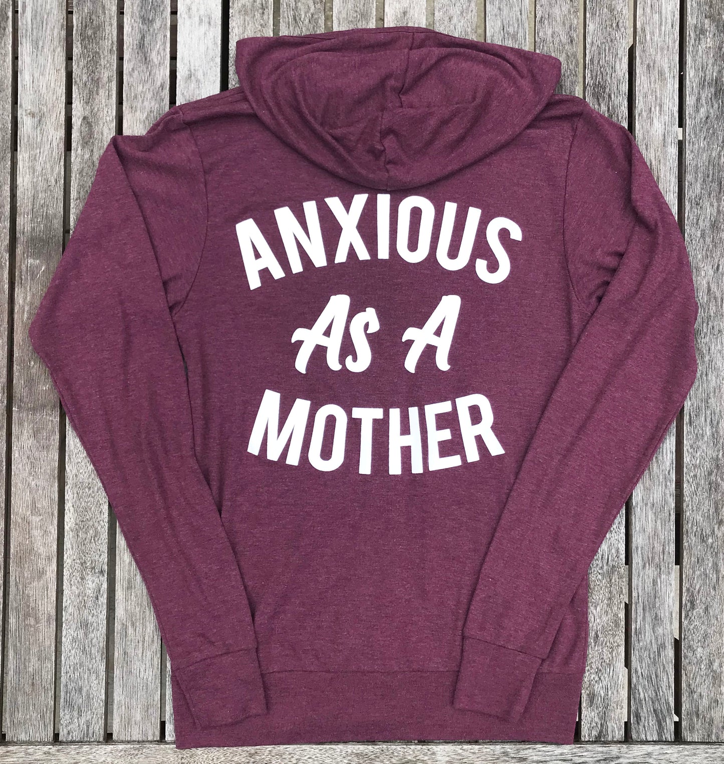 Heather maroon zip up sweatshirt that says, "ANXIOUS AS A MOTHER" on the back of the sweatshirt that's big and on the front of the sweatshirt that's small - winter - motherhood - mom life- crazy life - anxious - sweatshirt