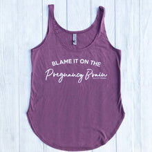 Purple wine colored tank top that says, "BLAME IT ON THE Pregnancy Brain" , the Pregnancy Brain section part is a cursive font and every word it white. - Pregnant - Gift - Maternity - Purple - Tank top - Graphic tank