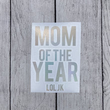 Holographic window car decal that says, "MOM OF THE YEAR JK" with the MOM and YEAR parts having bigger lettering than the other words. - okay mom - mediocre mom - motherhood -  car decal