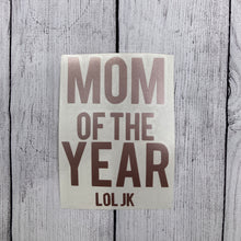 Holographic window car decal that says, "MOM OF THE YEAR JK" with the MOM and YEAR parts having bigger lettering than the other words. - okay mom - mediocre mom - motherhood - car decal
