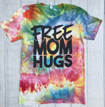 Rainbow tie dye with the writing saying, "FREE MOM HUGS", LGBTQ, PRIDE, PRIDE MONTH, JUNE PRIDE, MOM HUGS PRIDE, GAY MOM, TIE DYE PROUD MOM