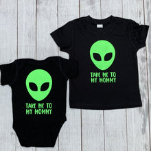 black tee with writing saying, "TAKE ME TO MY MOMMY", a lime green alien, font is limegreen - graphic tee - 