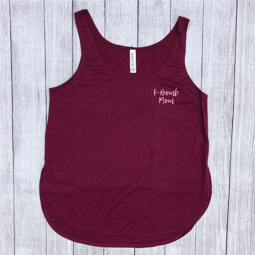 Maroon tank top with small pink writing saying, 